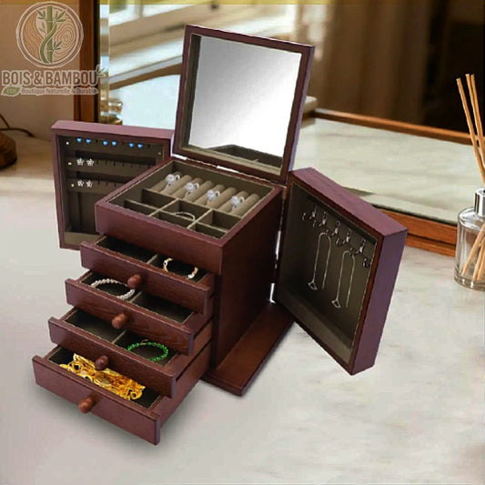 Grande boîte à bijoux en bois massif grand format avec miroir de courtoisie, quatre tiroirs spacieux et volets latéraux porte-colliers. Fabrication artisanale robuste et élégante pour une organisation complète de votre collection.