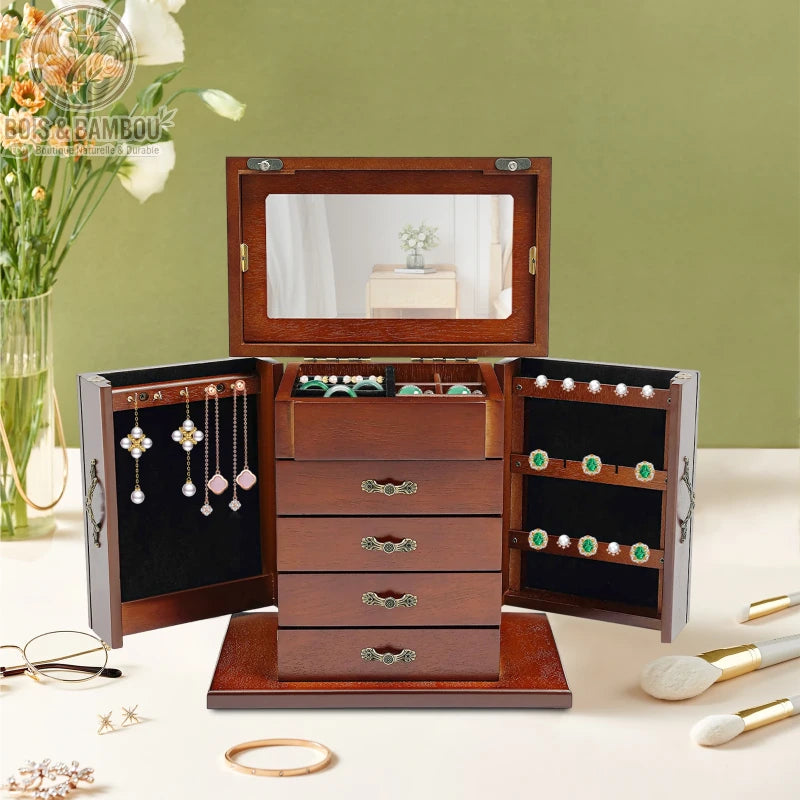 Boîte à bijoux vintage en bois précieux avec portes latérales battantes, tiroirs multiples et miroir. Fabrication artisanale au style rétro élégant pour le rangement de colliers, boucles d'oreilles et bagues.