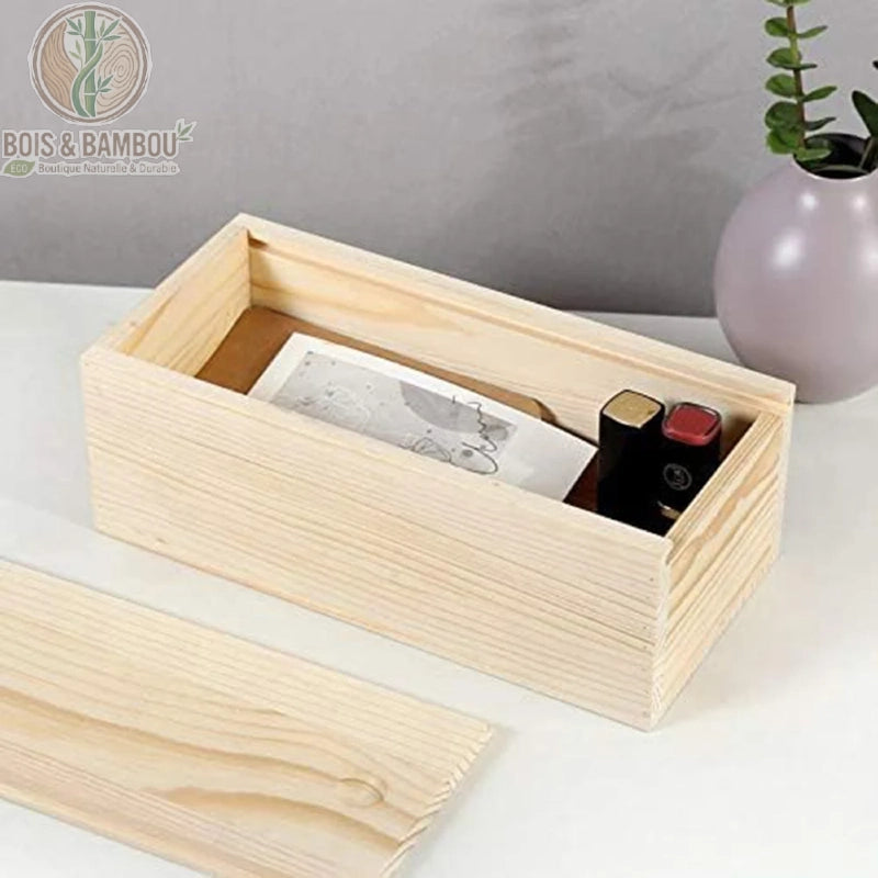 Grande boîte coulissante bois pin naturel ouverte bouteille de parfum et livre à l'intérieur