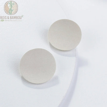 Boucles d'oreilles rondes en bois vintage coloris blanc fond clair