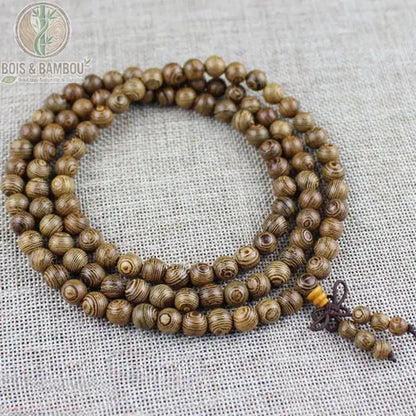 Bracelet mala bois de wengé 108 perles 8 mm enroulé trois tours fond lin nœud avec breloque