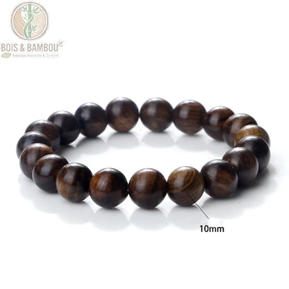 Bracelet perles palissandre noir modèle A tressé ajustable taille 10 mm porté au poignet