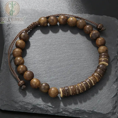 Bracelet ethnique perles de Bodhi et œil de tigre modèle 1 posé sur ardoise noire cordon ajustable marron