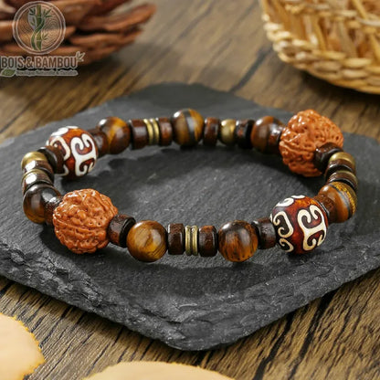 Bracelet ethnique Bodhi et œil de tigre modèle 3 graines sculptées orange perles dzi blanches sur ardoise noire