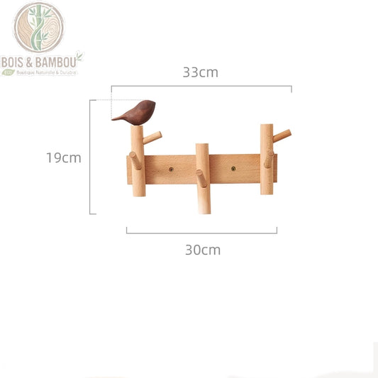 Cintre Mural en Bois 3 crochets claire 1 deco. Un porte-manteau mural en bois clair de 33 cm de long avec trois crochets et une figurine d'oiseau marron, indiquant ses dimensions précises.