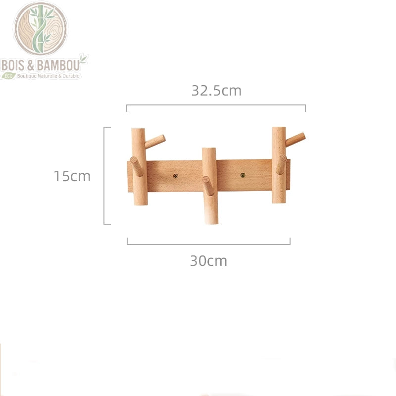 Cintre Mural en Bois 3 crochets claire. Un porte-manteau mural en bois clair de 32,5 cm avec trois crochets multidirectionnels, présentant ses dimensions techniques sur fond blanc.