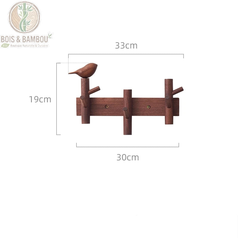 Cintre Mural en Bois 3 crochets marron 1 deco. Un porte-manteau mural en bois sombre de 33 cm avec trois crochets et une figurine d'oiseau sculptée, affichant ses dimensions précises.