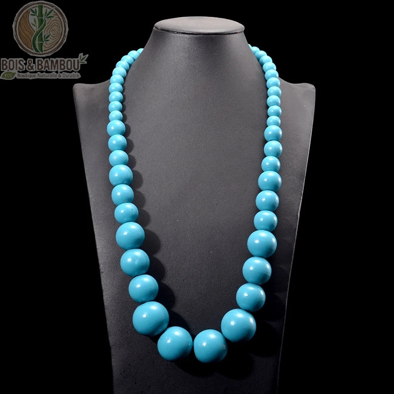 collier plastron grosses perles bois rondes graduées coloris bleu ciel sur buste noir