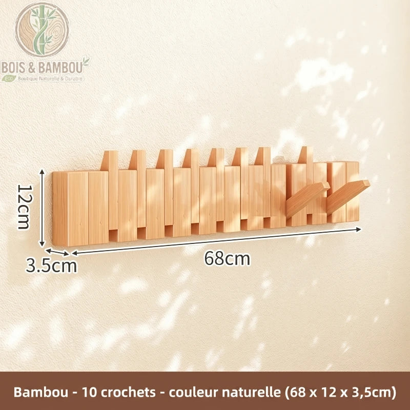 Porte Manteau Piano hetre claire 10 crochets. Un porte-manteau mural de 68 cm en bambou de couleur naturelle avec 10 crochets rabattables, affichant ses dimensions sur un mur ensoleillé.