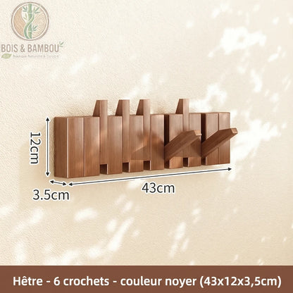 Porte Manteau Piano hetre fonce 6 crochets. Un porte-manteau mural de 43 cm en bois de hêtre couleur noyer avec 6 crochets rabattables, affichant ses dimensions sur un mur ensoleillé.
