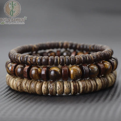 Set 3 bracelets bois de coco et yeux de tigre dorés empilés sur fond gris ardoise