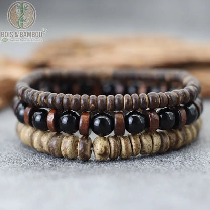 Set 3 bracelets bois de coco et onyx noir brillant empilés sur fond gris ardoise