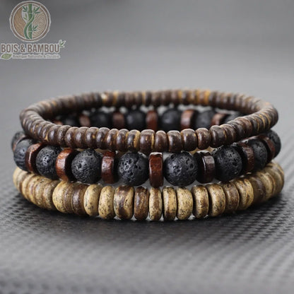 Set 3 bracelets bois de coco et pierre de lave noire poreuse empilés sur fond gris ardoise