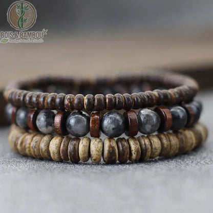 Set 3 bracelets bois de coco et onyx mat noir empilés sur pierre naturelle sombre