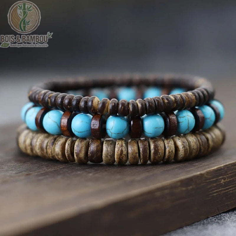 Set 3 bracelets bois de coco et obsidienne grise empilés sur fond gris ardoise