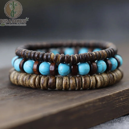 Set 3 bracelets bois de coco et obsidienne grise empilés sur fond gris ardoise