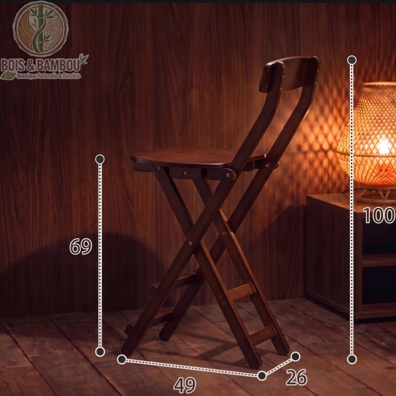 Tabouret de Bar en Bambou marron dimensions 1. Schéma d'un haut tabouret pliant marron avec mesures : hauteur totale 100 cm, assise à 69 cm, largeur 49 cm et profondeur 26 cm, dans un décor tamisé.