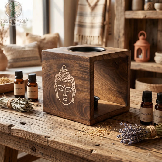 Brûleur d'huile en bois de manguier au visage de Bouddha gravé, en ambiance zen avec des huiles essentielles