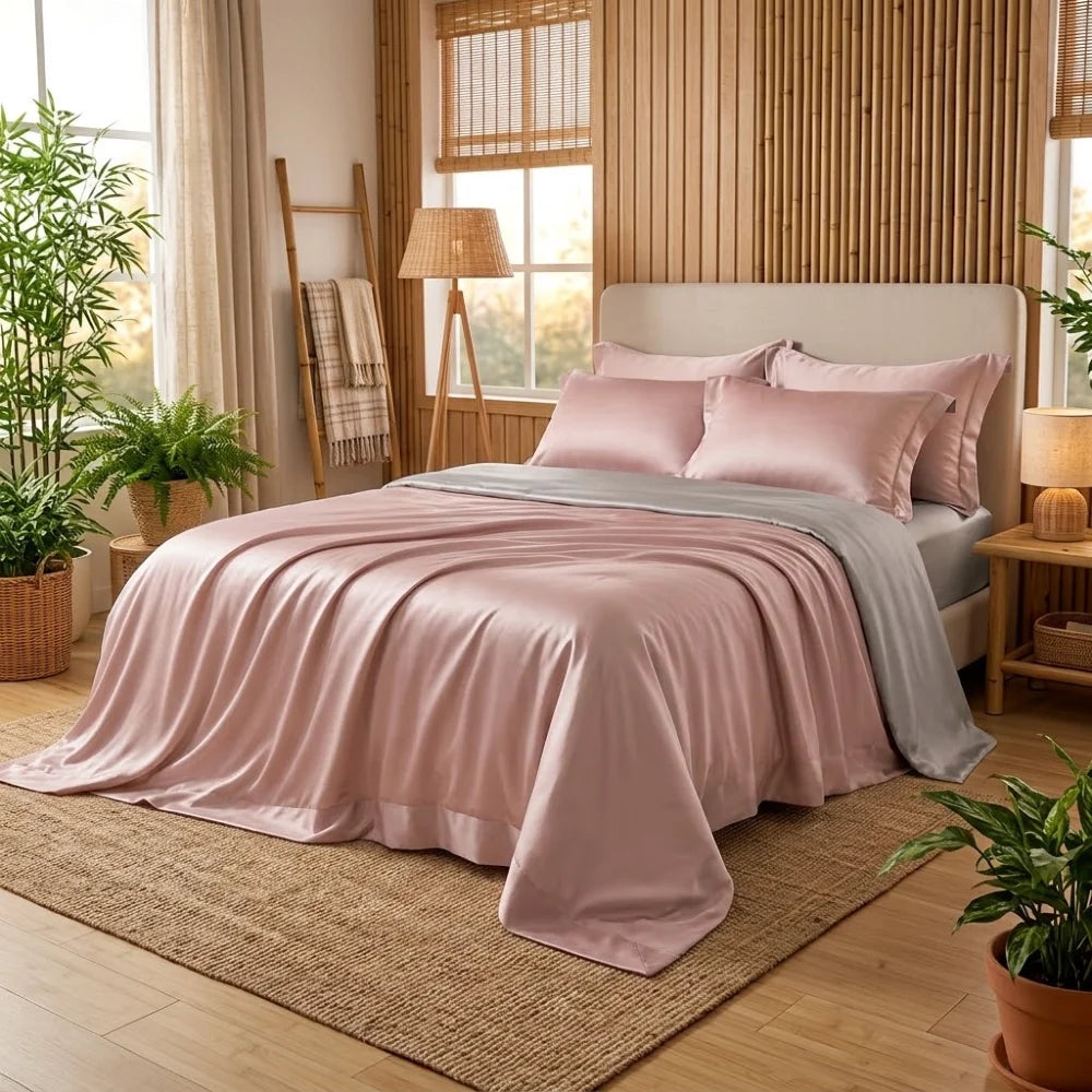 Housse de couette en bambou rose clair et gris perle sur un lit