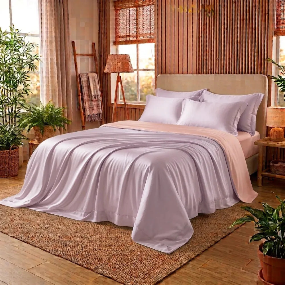 Housse de couette en bambou rose lilas et pêche sur un lit