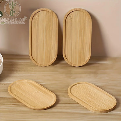 Plateau decoratif bambou ovale set 4 pieces debout et a plat en situation sur surface bois naturel, Bois et Bambou Eco.