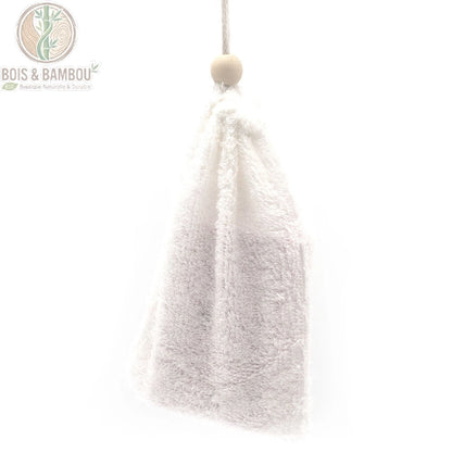 Sac à savon ouvert laissant apparaître un savon solide rose et son cordon coulissant