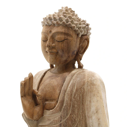 Visage serein et main levée dans le geste de l'enseignement, statue de Bouddha en bois de Suar