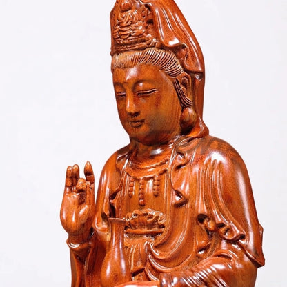 Détail de la statue Guan Yin en bois de rose sculpté à la main, visage, couronne, main levée et vase