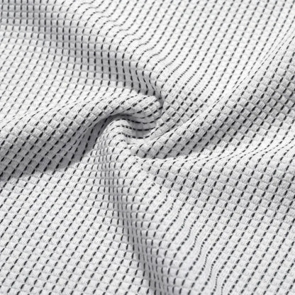 Gros plan sur le tissage gaufré de la maille de bambou, texture douce et respirante