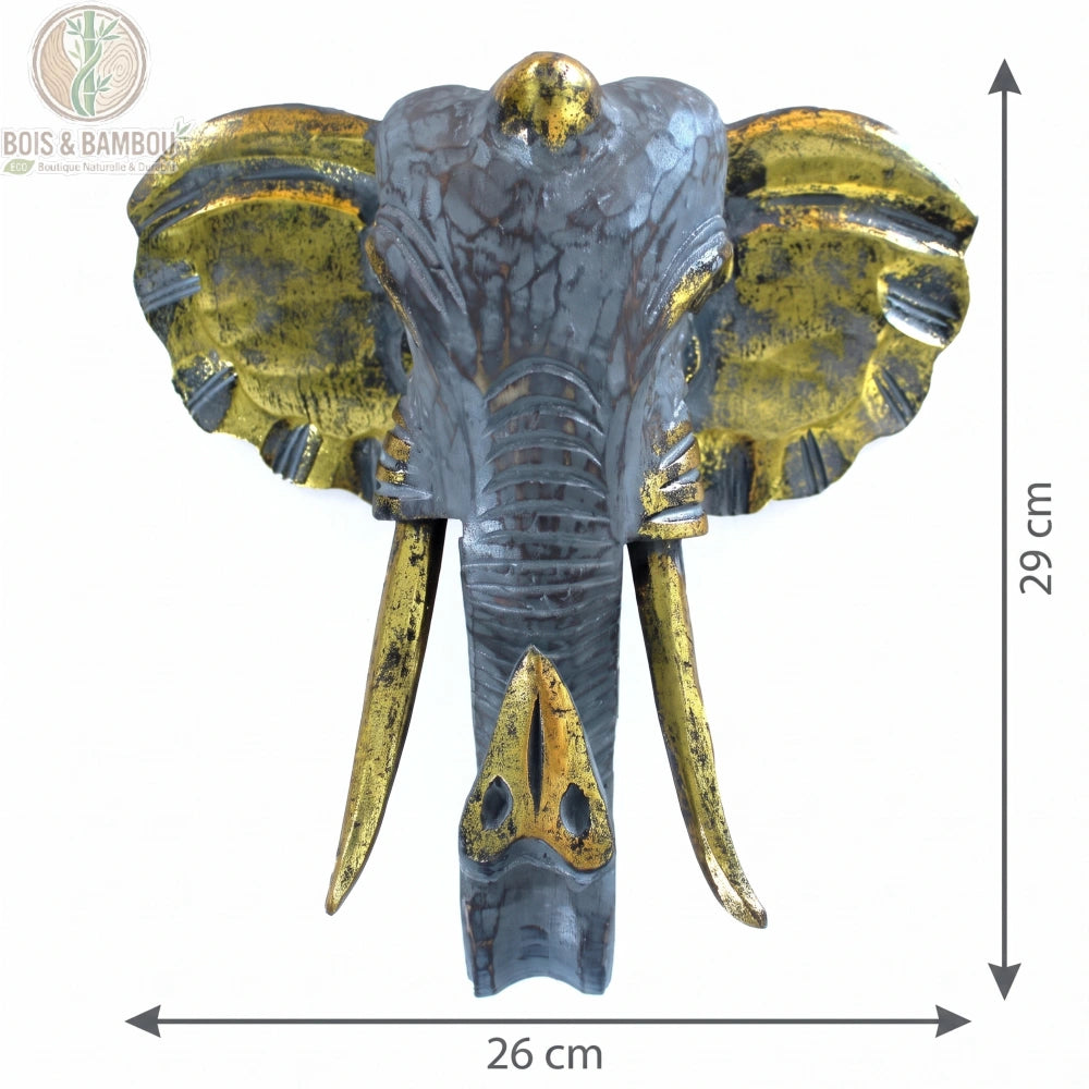 Tête d'éléphant en bois sculpté gris et doré, dimensions 29 par 26 cm