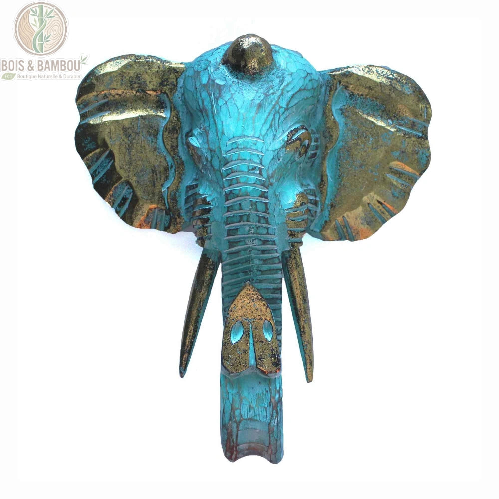 Tête d'éléphant en bois sculpté turquoise et doré, fond blanc